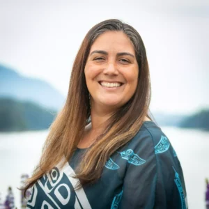 A headshot of Angela Michaud smiling for the camera.
