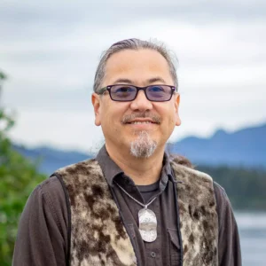 Joe Nelson smiles in this headshot photo.