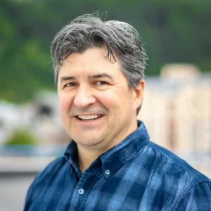 A headshot of Morgan Howard smiling for the camera.